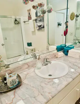 a bathroom with a sink and a mirror at Cozy private room in Santa Monica in Los Angeles