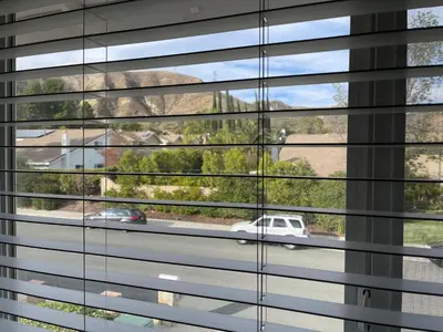a window with a view of a white car through it at LA Lux Suite with Private Bathroom in Santa Clarita