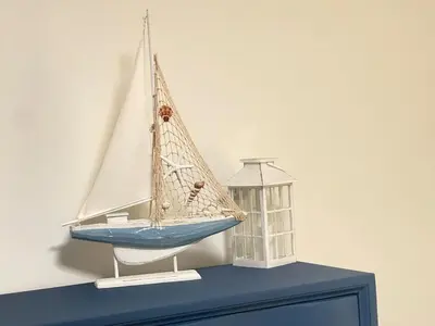 a model of a boat on top of a cabinet at 4BR Home near Universal - Private Pool, BBQ, Free Parking in Hickson