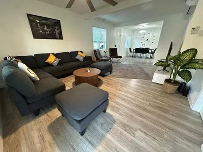 a living room with a couch and a table at Walkable to SoFi, Intuit Dome, Kia Forum World Cup in Inglewood