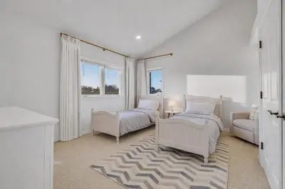 a bedroom with two beds and a couch and a chair at Luxury Retreat with Private Yard close to Beaches and FIFA Sleeps 10 in Torrance