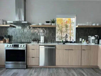 a kitchen with stainless steel appliances and a window at Castaway Cay near Disney with Hot Tub and Fire Pit in Anaheim