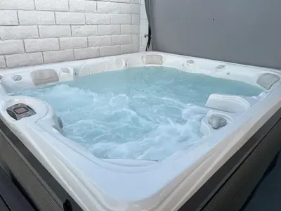 a jacuzzi tub with blue water in it at Castaway Cay near Disney with Hot Tub and Fire Pit in Anaheim