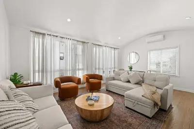 a living room with a couch and a table at Remodeled 1BR LA Apartment with full kitchen in Los Angeles