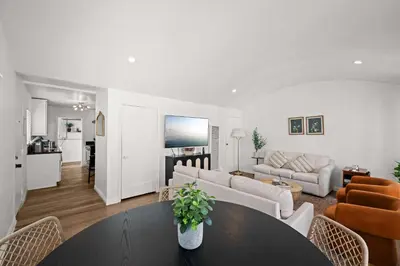 a living room with a table and a couch at Remodeled 1BR LA Apartment with full kitchen in Los Angeles
