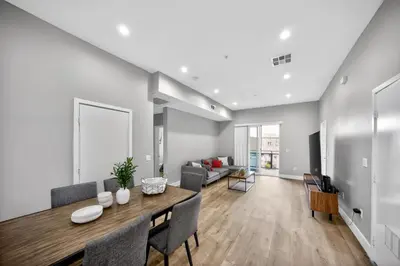 a dining room and living room with a table and chairs at #01 Spacious 3B3B Near Koreatown & Hollywood, Central LA in Los Angeles