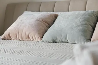 a bed with two pillows on top of it at Cute 1Bedroom apartment with pool view, parking and GYM in Los Angeles