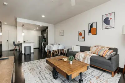 a living room with a couch and a table at Cute 1Bedroom apartment with pool view, parking and GYM in Los Angeles
