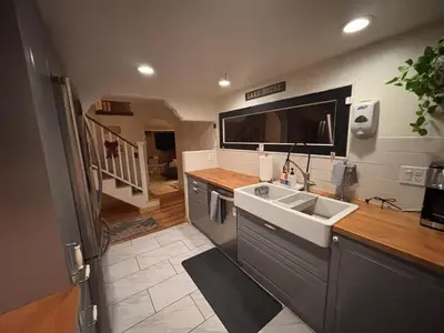 a kitchen with a sink and a counter top at Lakeview Location Hot tub Tesla Charger tree house in Big Bear Lake