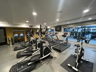 a gym with a bunch of treadmills and exercise bikes at ENSUITE MASTER BEDROOM IN WEST HOLLYWOOD - super host in Los Angeles