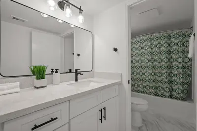a bathroom with a sink and a mirror and a toilet at LuxuryCondo DTAlhambra Near Starbucks Free2Parking in Alhambra