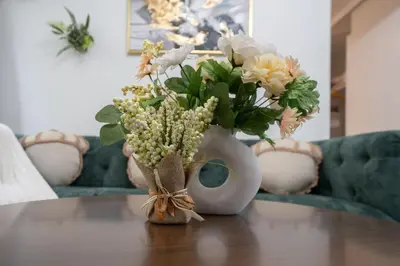 a vase filled with flowers sitting on a table at LuxuryCondo DTAlhambra Near Starbucks Free2Parking in Alhambra