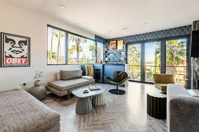 a living room with a couch and a table at Abracadabra Ultra Luxury Private Residence in Los Angeles