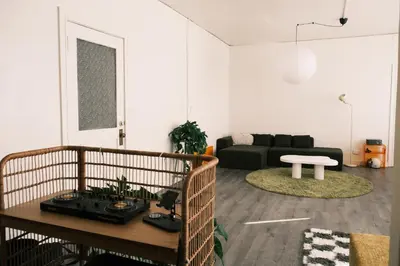a living room with a couch and a table at Paradise Knowhere in Los Angeles