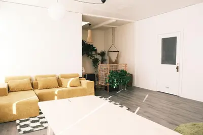 a living room with a couch and a table at Paradise Knowhere in Los Angeles