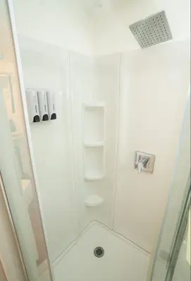 a bathroom with a shower with a glass door at silver in Chatsworth