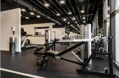 a gym with several treadmills and machines at Cozy 2BR Near Disneyland and Convention Center in Anaheim