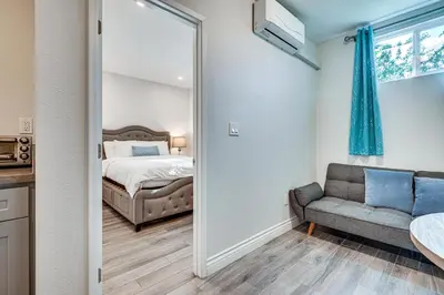 a bedroom with a bed and a couch at Explore Shops, Eats and Entertainment! Pasadena Apt in Pasadena