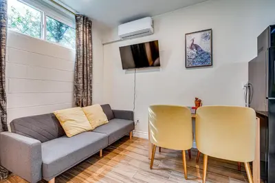 a living room with a couch and a table at 4 Mi to Old Pasadena! Well-Appointed Studio Stay in Pasadena