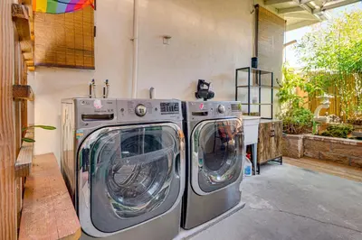 two washing machines sitting next to each other in a garage at 4 Mi to Old Pasadena! Well-Appointed Studio Stay in Pasadena