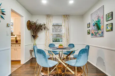 a dining room with a table and four chairs at Peacock House Sanctuary 4 Mi to Old Pasadena! in Pasadena