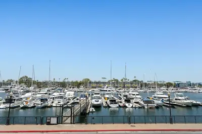 a bunch of boats docked in a marina at The Glass Anchor - 2 Bed Front-Row Marina Suite in Los Angeles