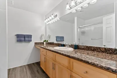 a bathroom with a sink and a mirror at The Glass Anchor - 2 Bed Front-Row Marina Suite in Los Angeles