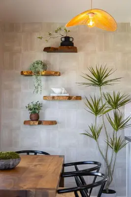 a dining room with a table and some plants at The Drift Manhattan Beach - steps to the ocean in Manhattan Beach