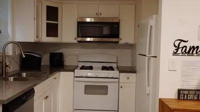 a kitchen with a white stove and a refrigerator at Paradise in LA near LAX and SoFi Stadium in Los Angeles