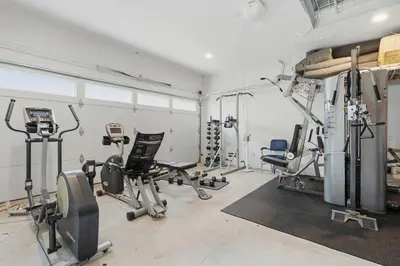 a gym with several treadmills and exercise equipment at New Listing West LA Urban Oasis by Colby & Conrad in Los Angeles