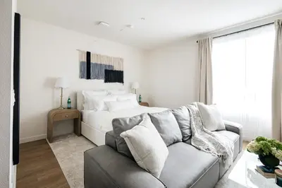 a living room with a couch and a bed at Platinum Space in WeHo in Los Angeles