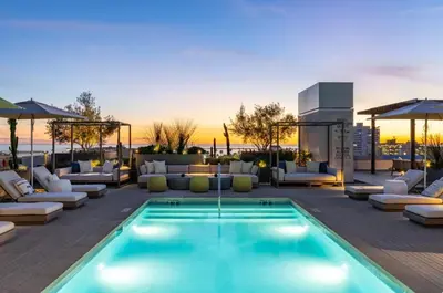 a pool on the roof of a hotel at The Velvet Coast - Grand 3BR Artistic Haven in Los Angeles