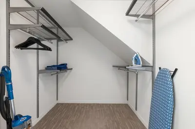 a walk in closet with metal shelves and a staircase at Ocean's Edge 2BR Penthouse - Infinite Blue Views in Los Angeles