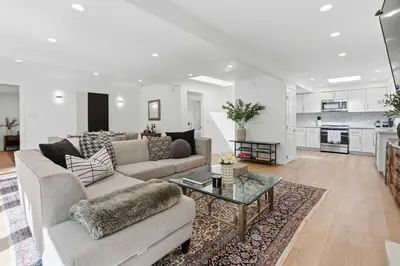 a living room with a couch and a table at Beverly Hills Canyon Estate by Colby & Conrad in Los Angeles