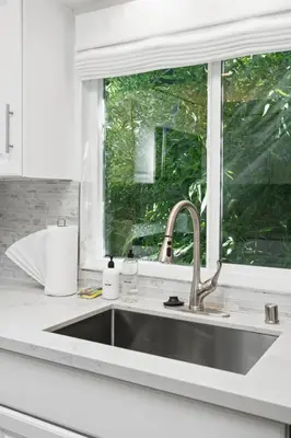 a kitchen with a sink and a window at Beverly Hills Canyon Estate by Colby & Conrad in Los Angeles