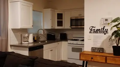 a kitchen with white cabinets and a counter top at Pop Art Themed Bedroom in House-Shared Bathroom-Shared Living Room & Kitchen in Los Angeles