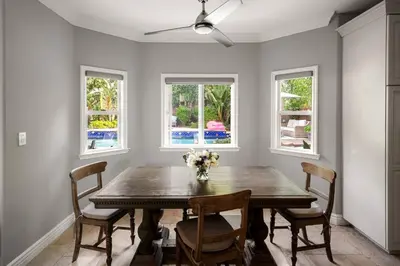 a dining room with a wooden table and chairs at Sherman Oaks Home w Pool, Spa and Outdoor Kitchen in Los Angeles