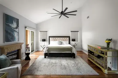 a bedroom with a bed and a couch at Sherman Oaks Home w Pool, Spa and Outdoor Kitchen in Los Angeles