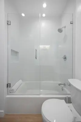 a white bathroom with a shower and a toilet at New Listing Iconic Venice Living by Colby & Conrad in Los Angeles
