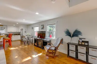 a kitchen and dining room with a table and chairs at Walk to Lake Arrowhead Village Bright Gem with Deck in Lake Arrowhead