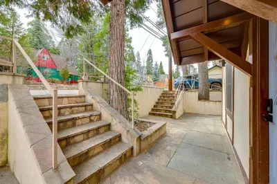 a set of stairs leading to a house at 1 Mi to Lake Arrowhead! All-Season Family Getaway in Lake Arrowhead