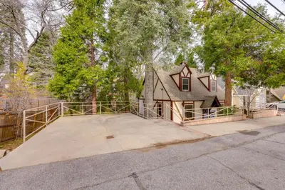 a house with a large driveway in front of it at 1 Mi to Lake Arrowhead! All-Season Family Getaway in Lake Arrowhead