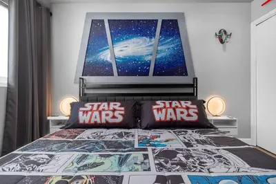 a bedroom with a star wars bed with star wars pillows at Star Wars Retreat by OC Adventure Homes in Garden Grove