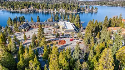 an aerial view of a resort on a lake at Holiday Lake Cabin by AvantStay Large Deck Cozy Fireplace Near Arrowhead Village in Lake Arrowhead