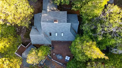 an overhead view of a house with a roof at Holiday Lake Cabin by AvantStay Large Deck Cozy Fireplace Near Arrowhead Village in Lake Arrowhead