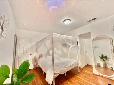 a bedroom with a white bed with a canopy at Spacious 3BR House Culver City Santa Monica & West LA in Los Angeles