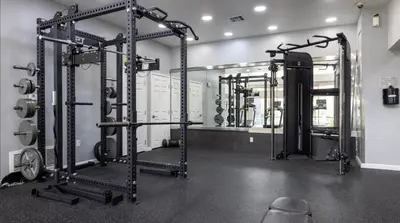 a gym with lots of equipment in a room at Golden Hour Glow - Stunning 3BR Overlooking the Marina in Los Angeles