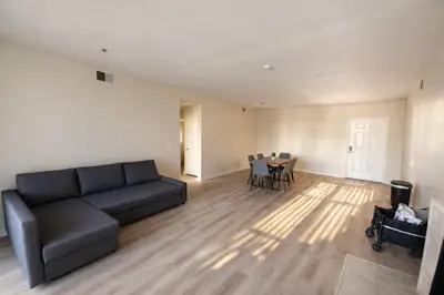 a living room with a couch and a table at Marina Del Rey 2BR-2BA & 1 BR-1BA - Easy Trip To Venice Boardwalk in Los Angeles