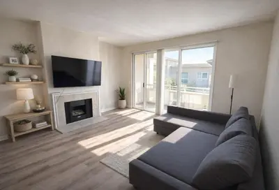 a living room with a couch and a fireplace at Marina del Rey Luxury 2BR 2BA - Close to Venice Beach in Los Angeles