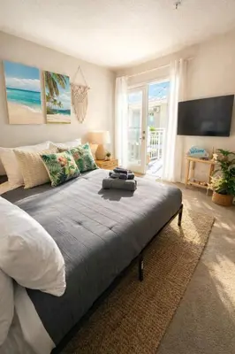 a bedroom with a large bed with a view of the ocean at Marina del Rey Comfort - Venice Beach Vibes - 2BR & 2BA in Los Angeles